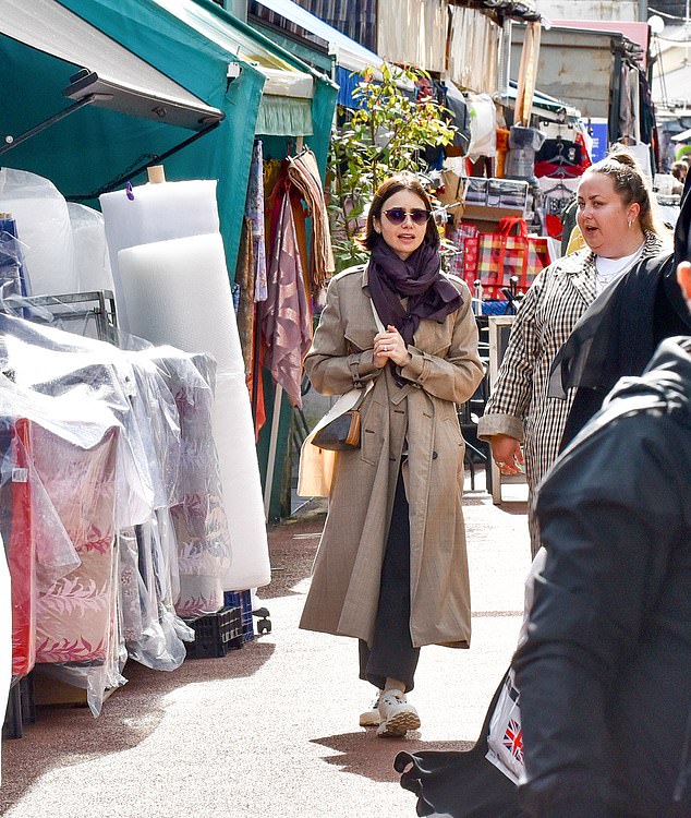 Accessorizing the look with a burgundy scarf and sunglasses, the Netflix star made her way through the market before purchasing a book at Special Rider Books & Records.