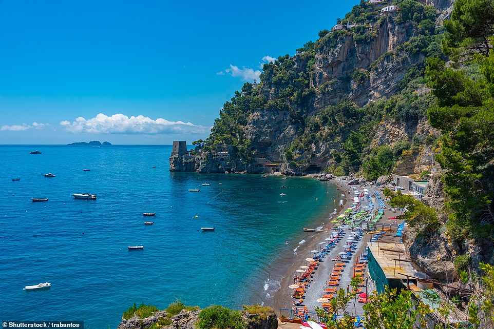 Harriet takes a day trip to Positano (seen above) where she enjoys lunch overlooking the town's black sand beach.