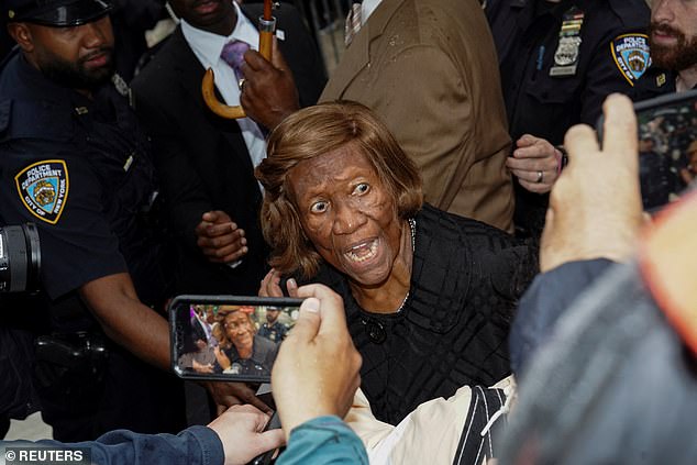 Dukes, a former NAACP leader, screamed at protesters who were choking her as she tried to speak in Adams' defense outside Gracie Mansion.