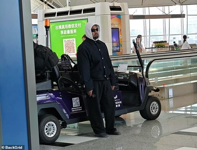 The rapper made a sad face as he appeared emotionless while walking through the airport.