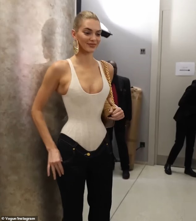 A video posted to Instagram by Vogue showed Jenner backstage in an extremely tight corset outfit.