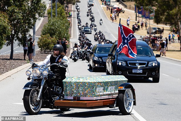 Rebel biker Nick Martin arrived at Pinnaroo Cemetery in a coffin covered with photographs of $100 notes (pictured) at his extravagant biker funeral on December 23, 2020.