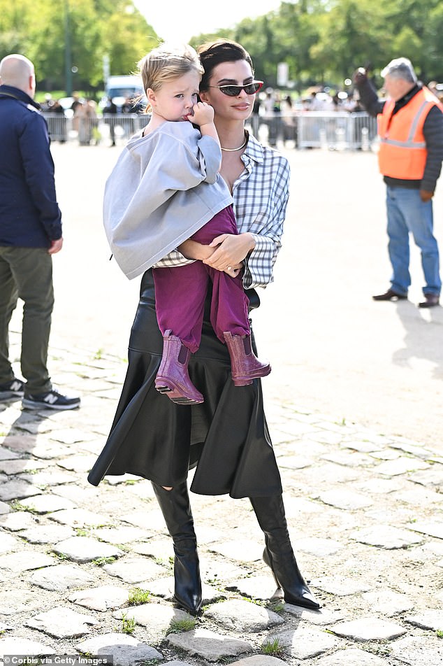 Meanwhile, her son looked adorable as he posed up a storm in a pair of purple trousers and stylish matching wellies.