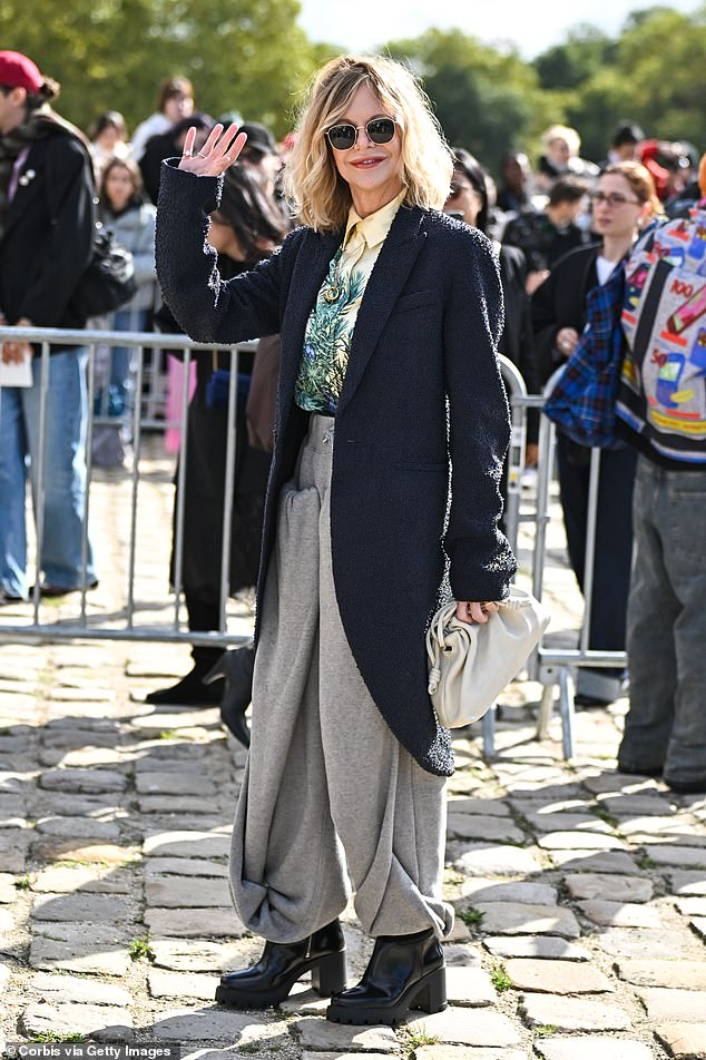 Meanwhile, Meg Ryan cut a stylish figure in a navy coat, gray pants and a floral shirt.