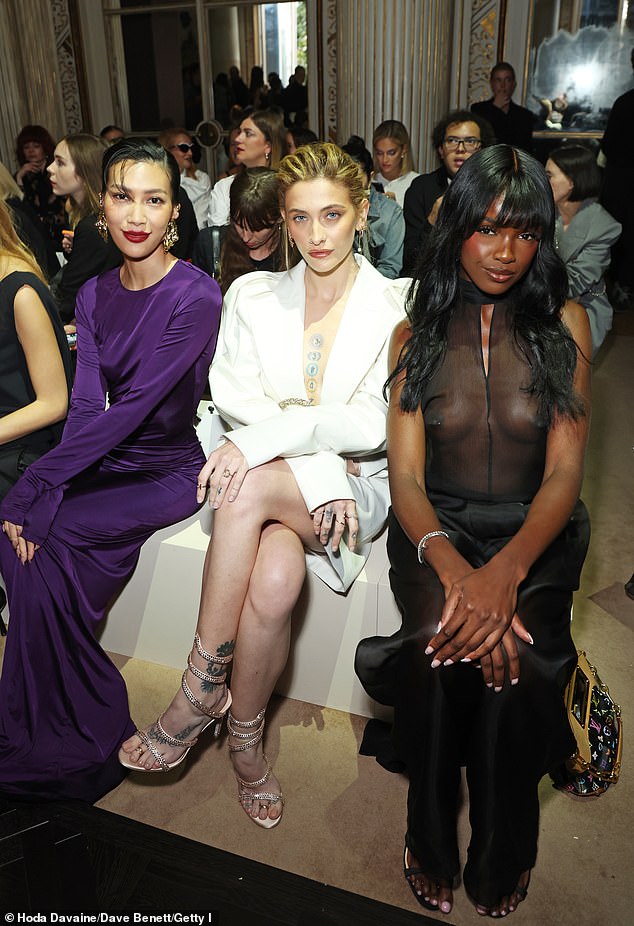 Paris posed between Molly Chiang and Leomie Anderson at the Nina Ricci show