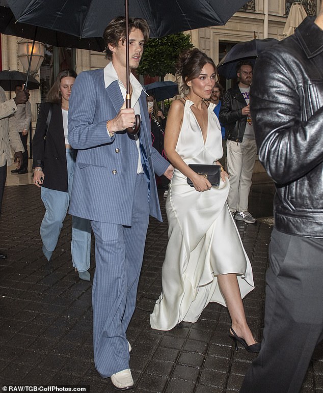 Cruz (seen with his girlfriend Jackie Apostel) also wore an item made by his mother: a baby blue pinstripe suit that is his first foray into men's fashion.