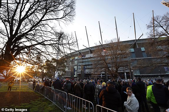 MELBOURNE, AUSTRALIA - SEPTEMBER 28: Football fans line up outside the members gates before the AFL Grand Final match between Sydney Swans and Brisbane Lions at Melbourne Cricket Ground, on September 28, 2024, in Melbourne, Australia. (Photo by Darrian Traynor/AFL Photos/Getty Images)