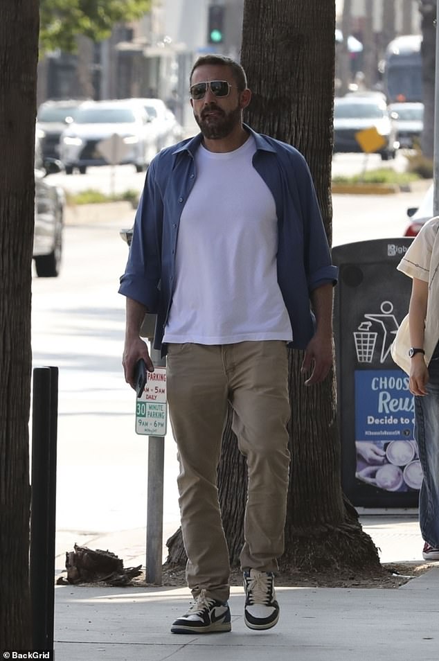 Enjoying time with his son, the father of three kept it low-key in a white T-shirt and blue button-downs paired with khaki pants.