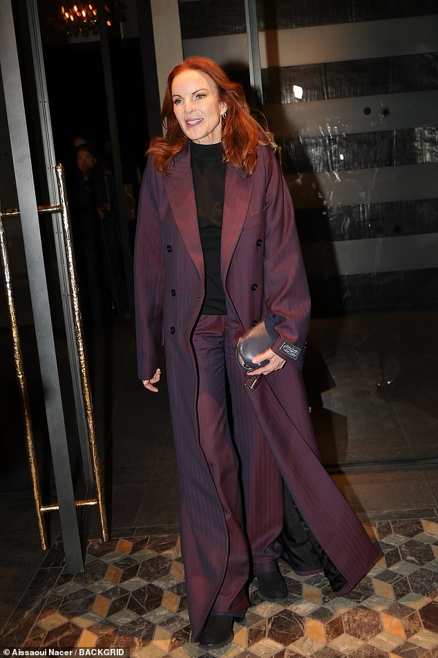 American actress Marcia Cross turns heads in a striking plum-colored suit at the Vetements party held at Costes in Paris.