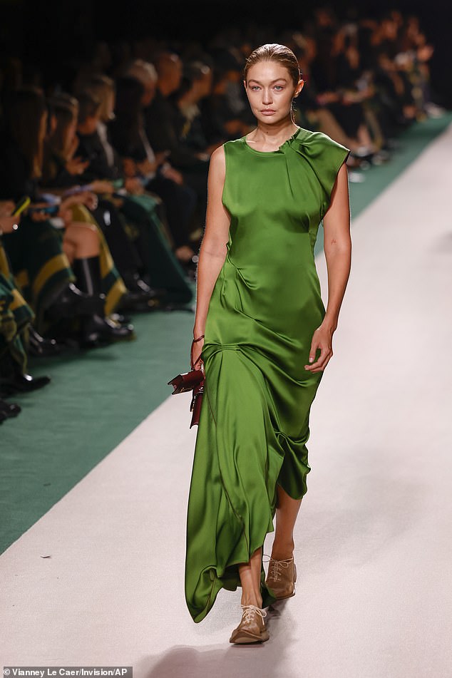 The show was headlined by none other than Gigi Hadid, 29, who stormed the runway in a stunning green draped dress.