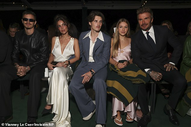 Victoria's famous family beamed with happiness as they sat in the audience alongside Vogue's Anna Wintour for the presentation of her Spring/Summer 2025 collection.