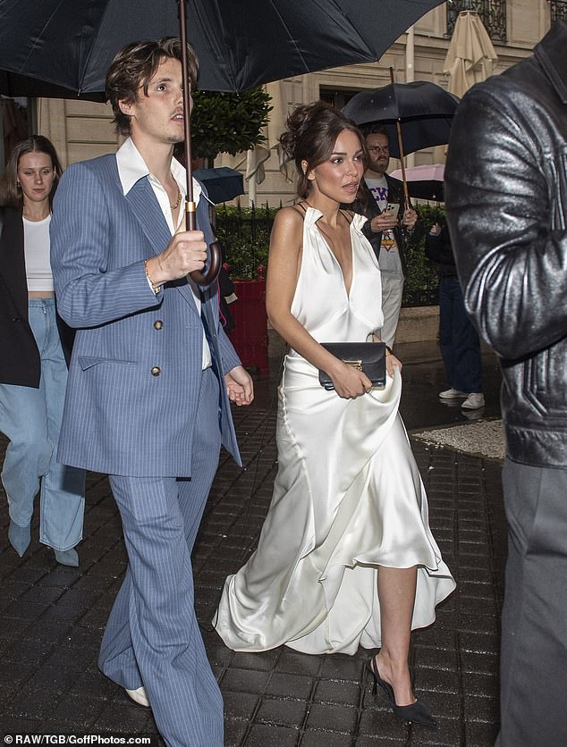 Aspiring singer Cruz put on a dapper display for the event, wearing a cerulean striped suit ensemble, paired with sleek white pumps as he arrived with his girlfriend Jackie Apostel.