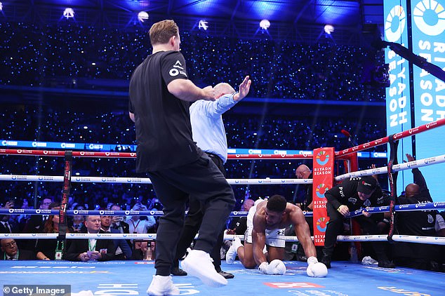 Joshua's trainer Ben Davison was the first in the ring after last weekend's knockout, but his prior advice in the corner may have confused Joshua.