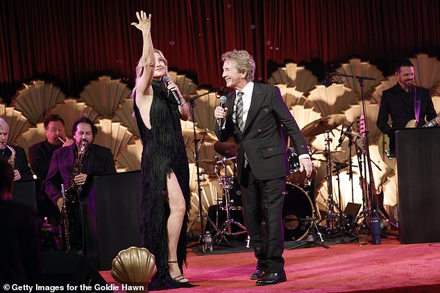 At the event, Hawn celebrated 20 years of her foundation's MindUP mental health program at festivities held at Ron Burkle's Greenacres (Kate pictured with Martin Short).