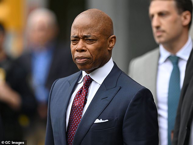 Hours before the visit, Adams is seen leaving Manhattan Federal Court after pleading not guilty.