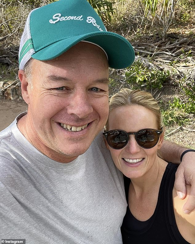 Ben (pictured with his partner) said he was riding with cycling coach Cam Hughes when he swerved to avoid a black snake on the road.