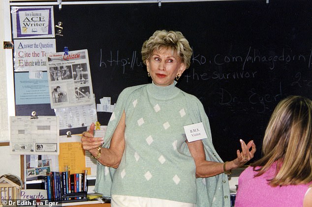 Dr. Eger giving a presentation to a classroom full of students in the 1980s