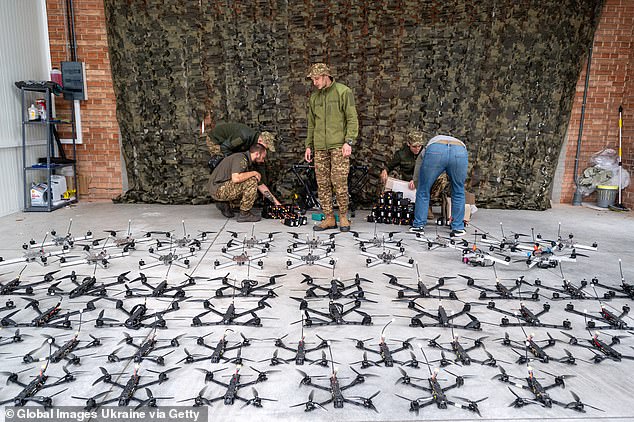 Soldiers of the Armed Forces inspect FPV drones during the delivery of the volunteer organization on September 13, 2024 in Lviv, Ukraine.