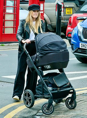 Joanne safely pushes her newborn's £750 pram to the pavement