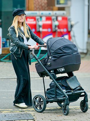 The mother walking on the sidewalk.