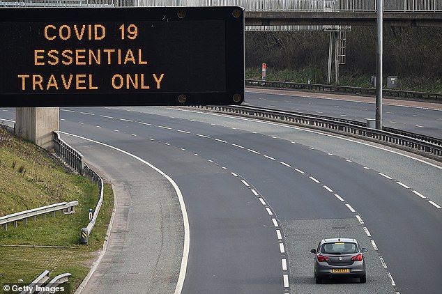 The M8 motorway near Glasgow as an electronic sign displays a clear message in March 2020