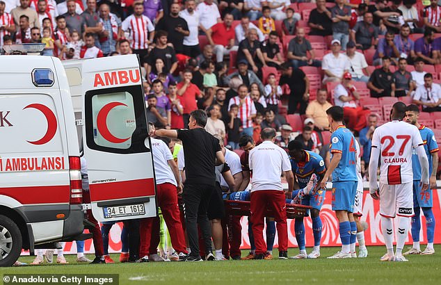 He was taken by ambulance from the field to the hospital after being treated by medical personnel.