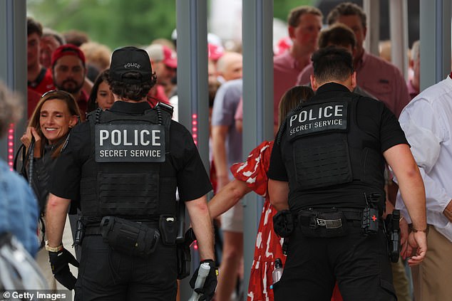 Secret Service members searched many people entering Bryant-Denny Stadium.