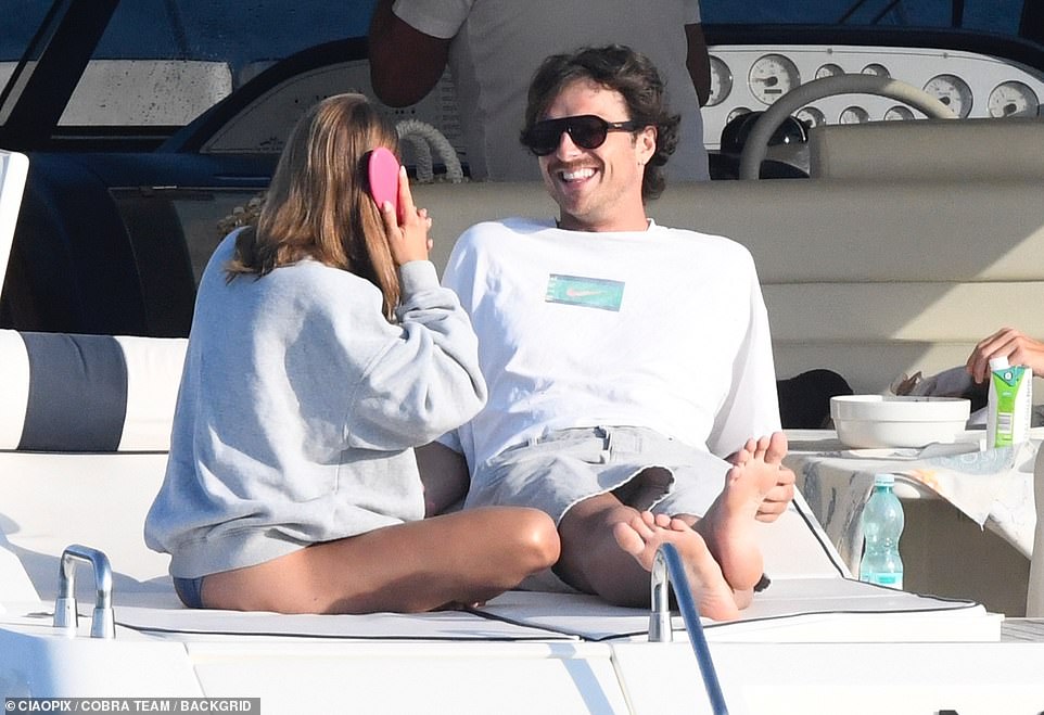 Later that day, Elordi was seen wearing a white sweatshirt and tan shorts while lounging on the boat.