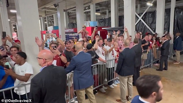 The Secret Service set up walkways only for Trump to enter and exit while he was inundated with fans who watched and applauded at times.