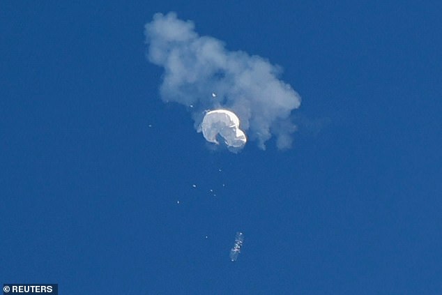 The suspected Chinese spy balloon drifts toward the ocean after being shot down off the coast in Surfside Beach, South Carolina, on February 4, 2023.