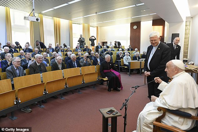 Pope Francis attends a private meeting with Jesuit brothers during a visit to Collage Saint-Michel, a Jesuit school on September 28, 2024 in Brussels, Belgium.