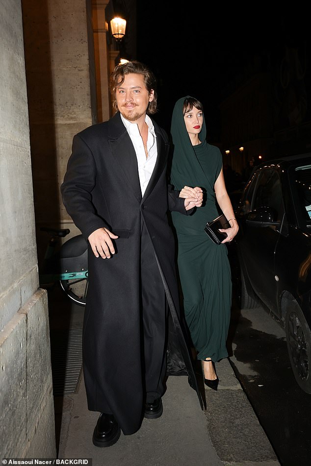 Cole Sprouse was also joined by his girlfriend Ari Fournier, who opted for a spectacular forest green hooded dress.