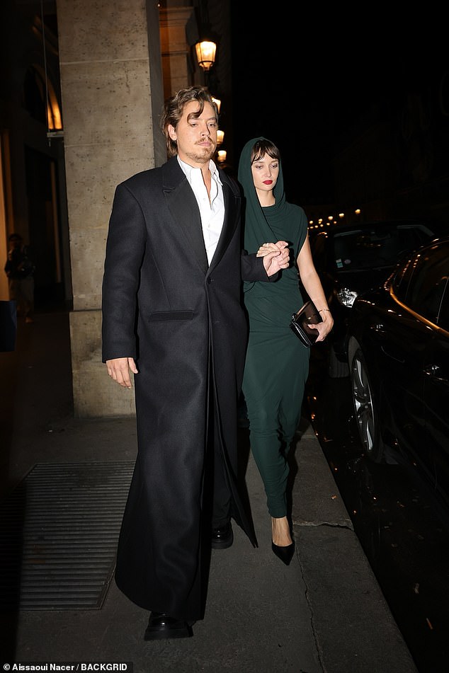 The actor cut a smooth figure in a smart black suit as he left the hotel with his girlfriend after a night out.