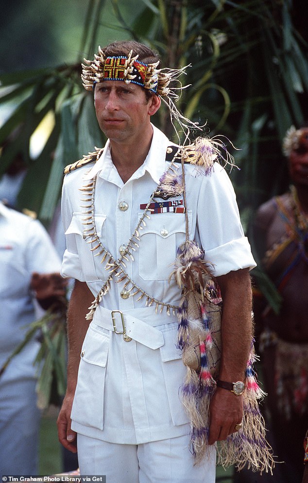 Pictured: Prince Charles during a visit to Papua New Guinea, wearing traditional dress.