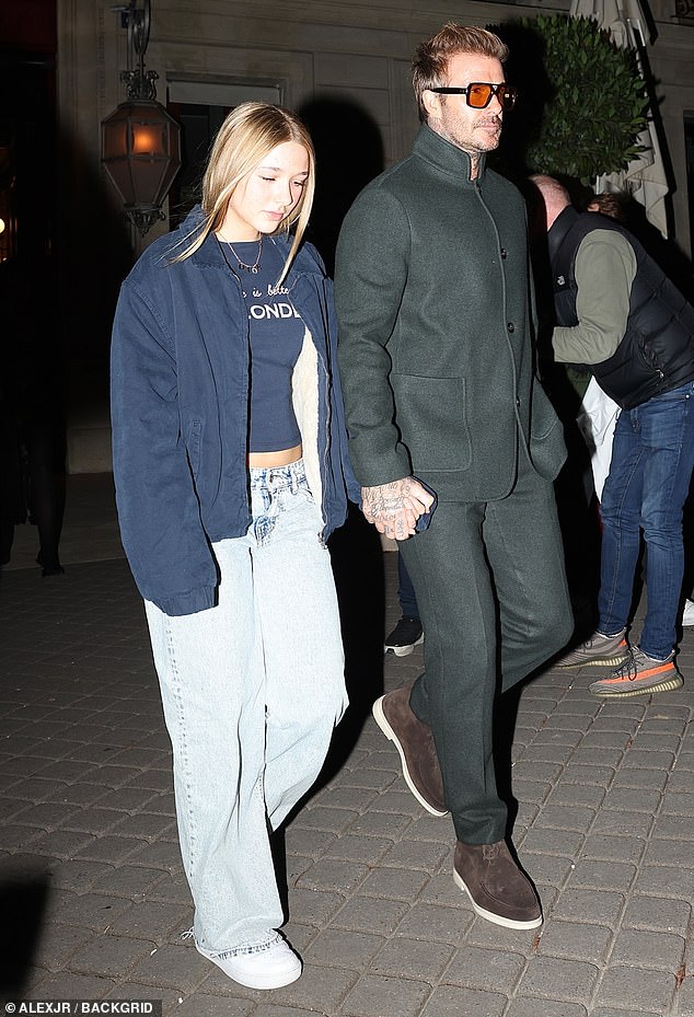 David looked dapper in a black jacket and matching pants as he walked hand in hand with Harper.