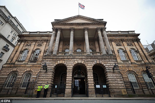 Police officers stand guard outside Liverpool Town Hall on September 10; the building houses the ongoing Thirlwall investigation into the Lucy Letby case.