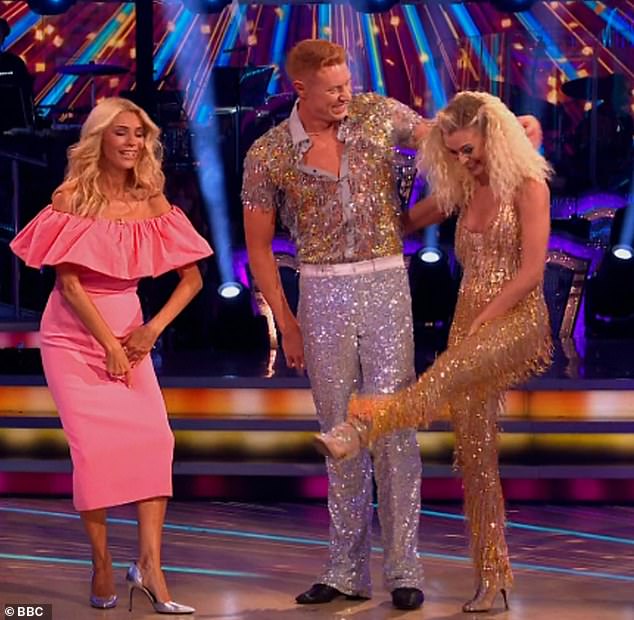 Meanwhile, pro Nadiya Bychkova, 36, kicked off the show as she and Olympian Tom Dean, 24, strutted their stuff in sequins in a disco-inspired Cha Cha, only for her skin-tight sequin jumpsuit to It will tear between his legs.