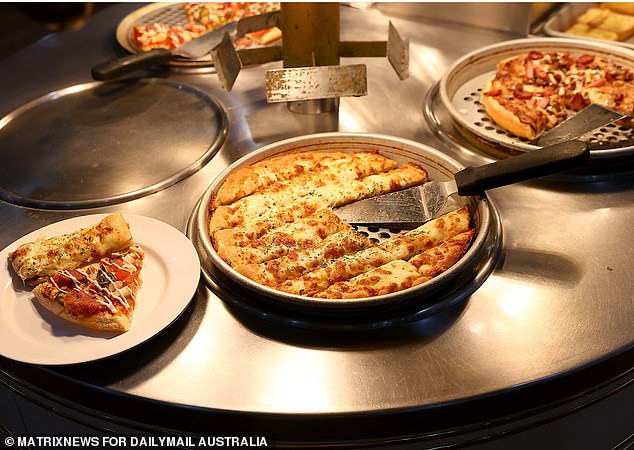 While diverse food has gone out of fashion in Australia, Mr Ahuia's Pizza Hut restaurant continues to not only survive, but thrive.