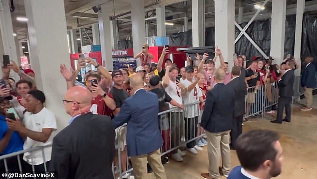 The Secret Service set up walkways only for Trump to enter and exit while he was inundated with fans who watched and applauded at times.