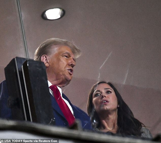 Trump speaks with Republican Senator Katie Britt at the Alabama vs. Georgia college football game.