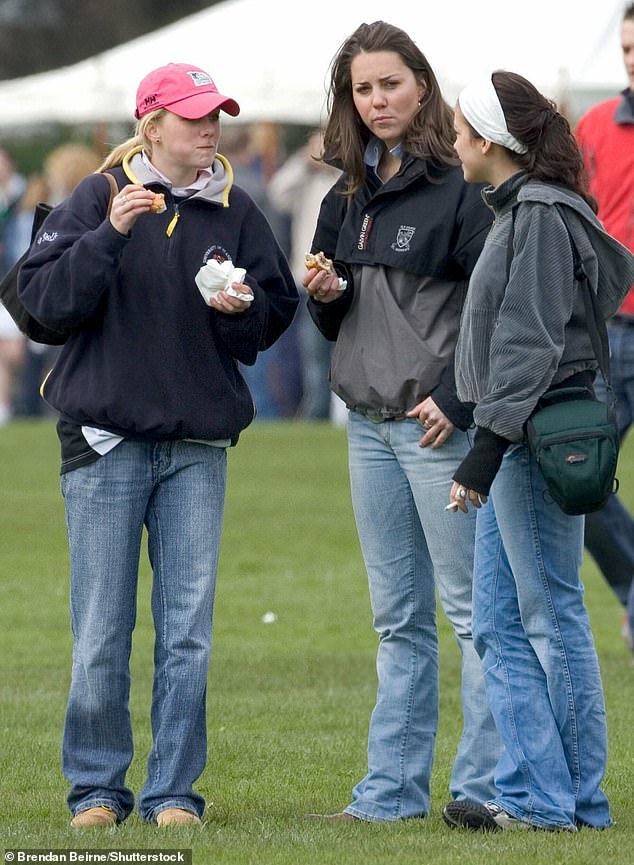 Kate chatting with her university friends while watching William play rugby in April 2005.