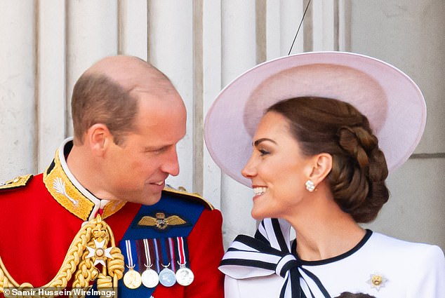 The couple enjoys a tender moment on the balcony of Buckingham Palace during Trooping the Color in June.