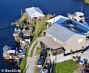 The couple exchanged vows by the water in Des Allemandes, on the same marsh where he operates his popular marsh boat tours.