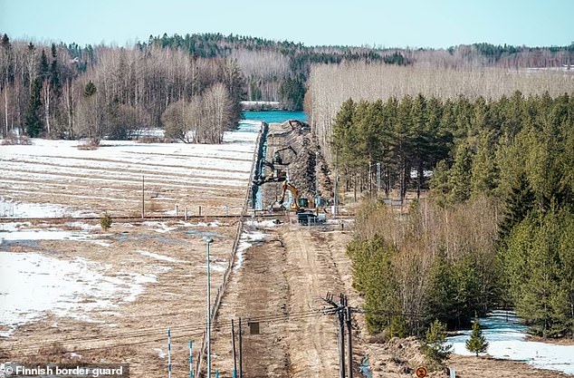 Finland hopes to avoid a repeat of events on the EU's eastern border in Poland in the winter of 2021, when Belarus, a staunch ally of Russia, engineered a crisis by flying in migrants from the Middle East, granting them visas and pushing them to cross the border. Pictured: Construction of another section of fence earlier this year.