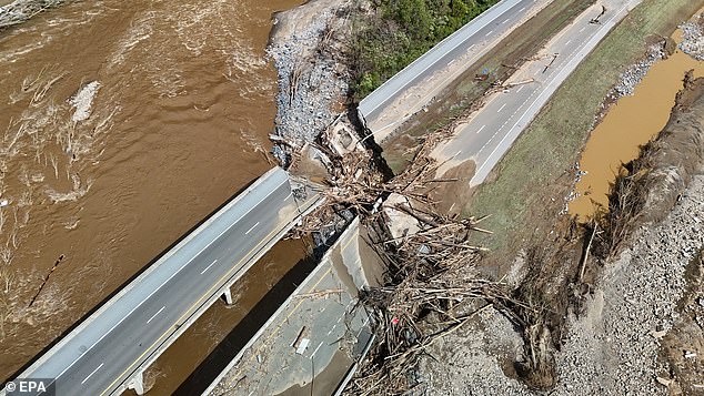 Flooding and damage from storm that began as Hurricane Helene covering streets in Erwin, Tennessee