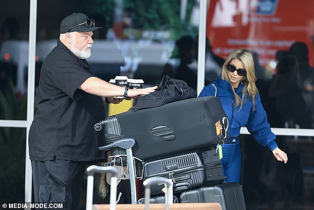 Kyle did the balancing act at one point while trying to push his pile of luggage while carrying a tray of coffee cups.