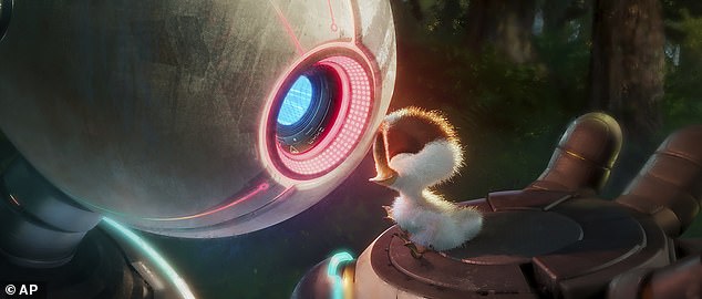 Roz, voiced by Oscar winner Lupita N'Yongo, and Brightbill, voiced by Kit Connor, appear in a scene from the DreamWorks Animation film The Wild Robot.