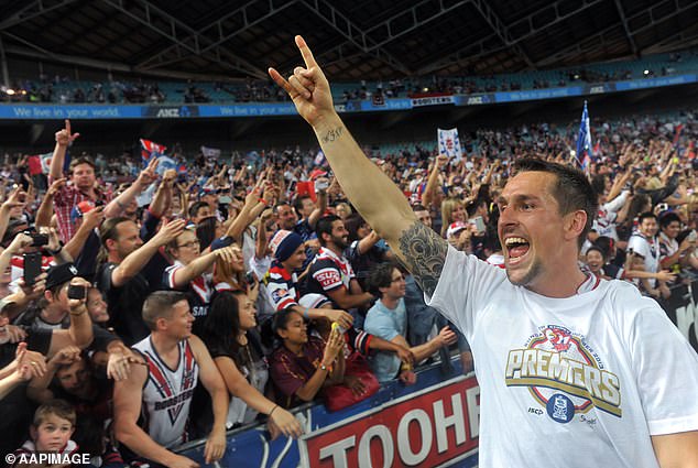 Pearce would have a successful football career, including winning the 2013 premiership with the Roosters (pictured).