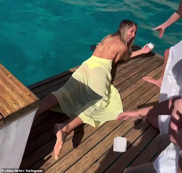 DJ Fisher and his wife Chloe shared a clip of the heart-stopping moment the bridesmaid dropped one of the rings overboard after the couple's three-month-old daughter, Bobbi, 