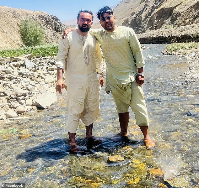 The group stopped at a watering hole to dip their feet in a stream.